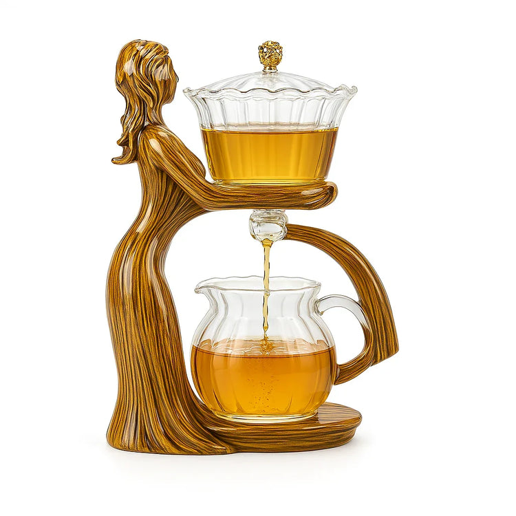 Artistic glass tea set with amber liquid, featuring a woman-shaped wooden stand and elegant curved design.
