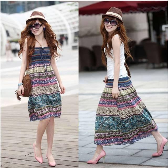 Woman wearing a sleeveless boho maxi dress with multicolor stripes, loose fit, lightweight fabric