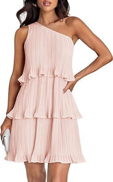 Woman wearing a light pink pleated one-shoulder tiered mini dress with relaxed fit