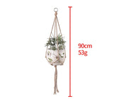 Natural rope plant hanger with 90cm length, holding a white floral ceramic pot