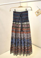 Boho style long skirt with multicolor ethnic patterns, elastic waist, and flowy fit.