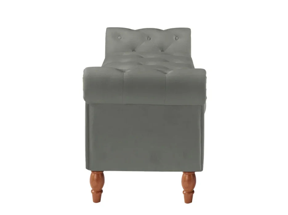 Gray tufted velvet bench with wooden legs and button details, contemporary furniture style