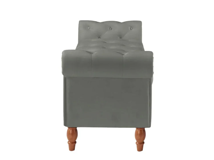 Gray tufted velvet bench with wooden legs and button details, contemporary furniture style