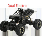 Black off-road remote control truck with large rugged tires and roll cage design
