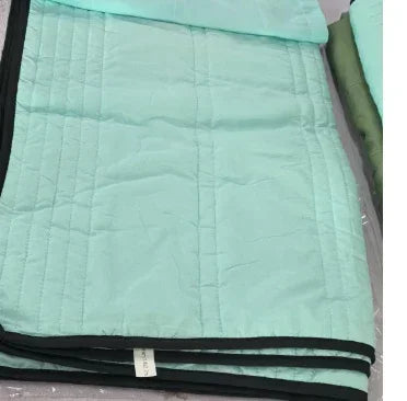 Light teal quilted jacket with black trim, lightweight streetwear, regular fit