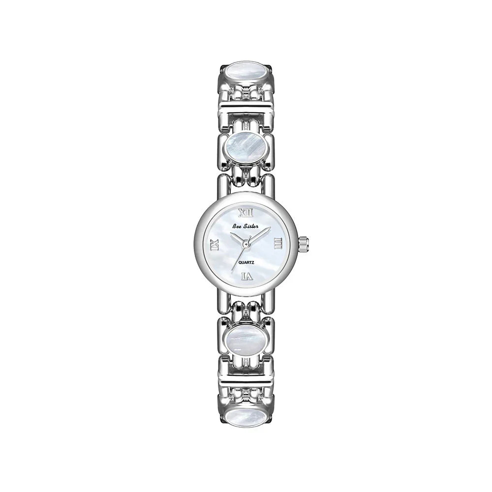 Silver metal wristwatch with round white dial and Roman numerals, polished link bracelet