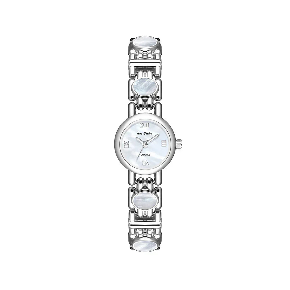 Silver metal wristwatch with round white dial and Roman numerals, polished link bracelet