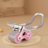 Pink and gray ab roller with phone holder, ergonomic handles, and rubber wheels on beige background