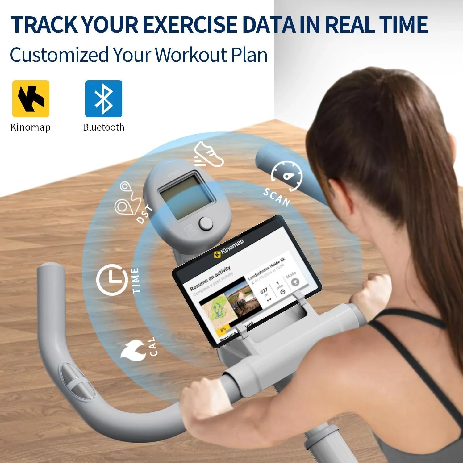 Woman in a black sports top using a grey smart exercise bike with real-time fitness tracking display.