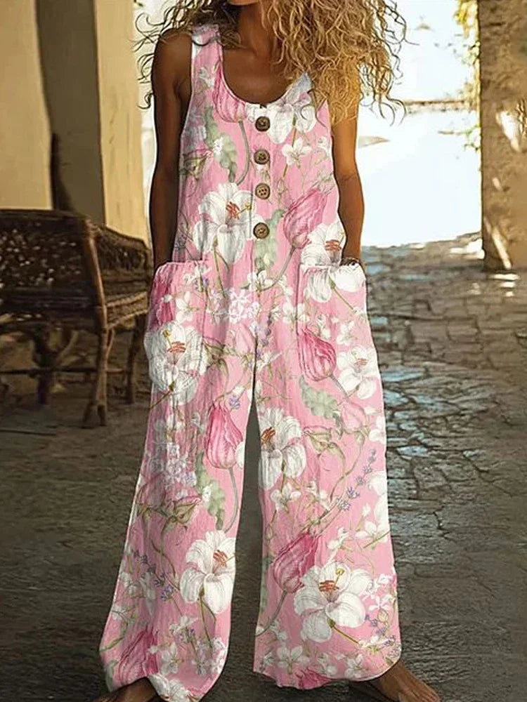 Woman wearing a loose-fitting pink floral jumpsuit with buttons and wide legs