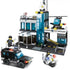 Black and white plastic SWAT building block set with figures, police vehicles, and helicopter.