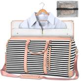 Black and white striped weekender bag with light pink accents, holding a light blue collared shirt, and a clear zippered pouch.