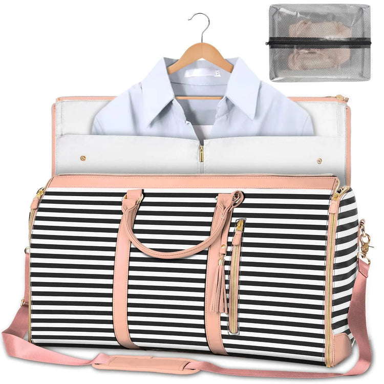 Black and white striped weekender bag with light pink accents, holding a light blue collared shirt, and a clear zippered pouch.