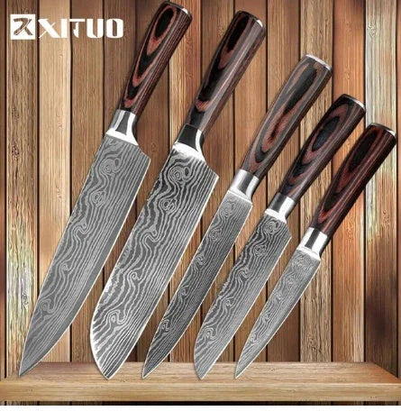 Set of five Damascus-style steel kitchen knives with dark wood handles on wooden background