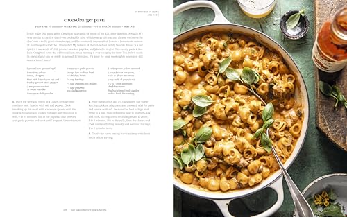 Half Baked Harvest Quick & Cozy cookbook open to cheeseburger pasta recipe with a creamy pasta dish garnished with basil leaves.