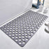 Gray non-slip bath mat with circular holes, modern bathroom setting, rubber material