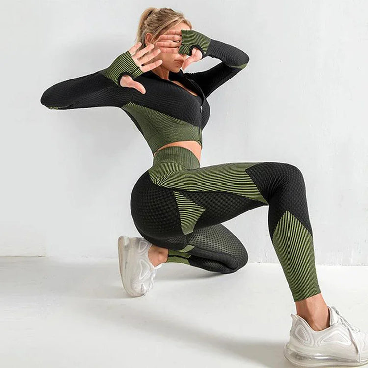Woman wearing textured green and black seamless workout set with fitted crop top and leggings
