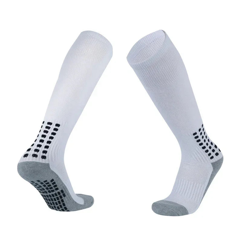 White knee-high athletic socks with black grip pads and gray reinforced toes and heels