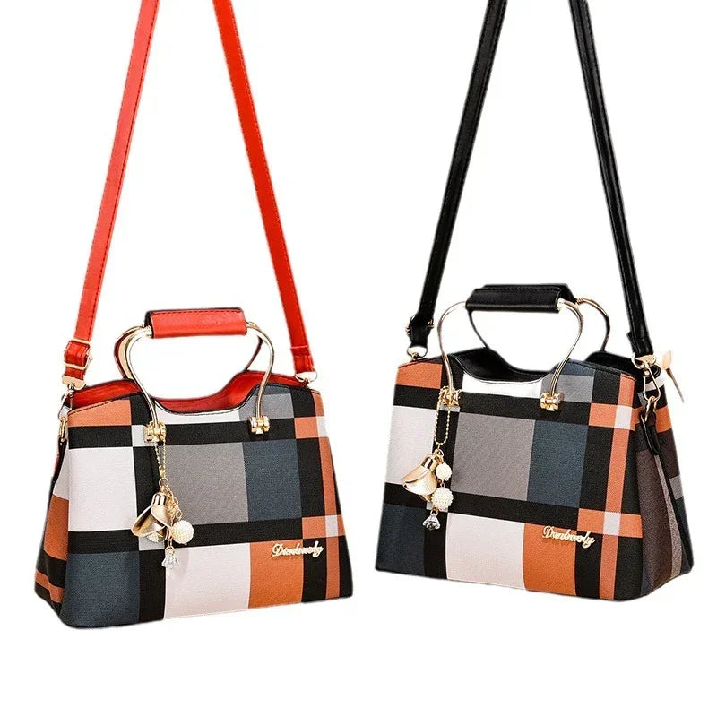 Two plaid pattern handbags with gold handles, detachable shoulder straps, and bell charms