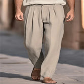 Beige pleated wide-leg pants, relaxed fit, lightweight fabric, casual street style.