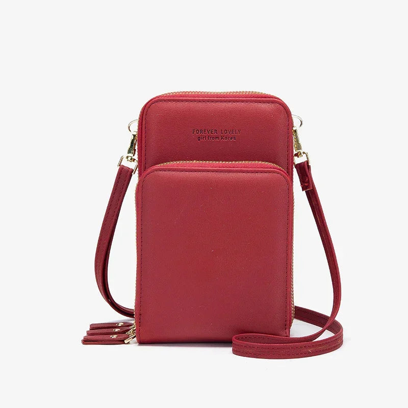 Red faux leather crossbody phone bag with dual zip compartments and gold hardware