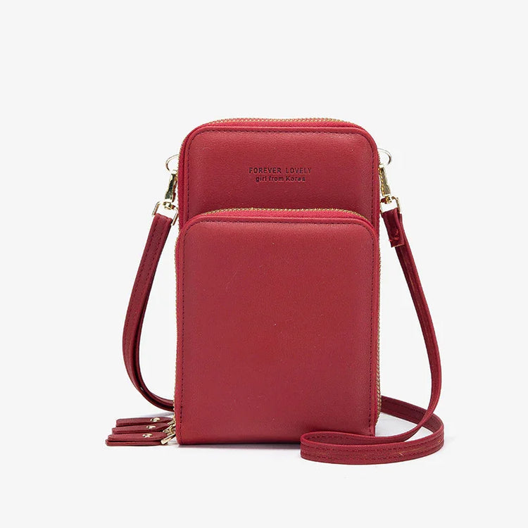 Red faux leather crossbody phone bag with dual zip compartments and gold hardware
