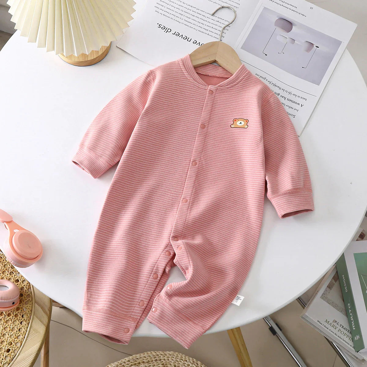 Pink striped baby romper with bear patch, soft cotton, long sleeves, relaxed fit