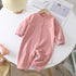 Pink striped baby romper with bear patch, soft cotton, long sleeves, relaxed fit