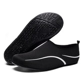 Black slip-on mesh water shoes with white accents and flexible rubber sole