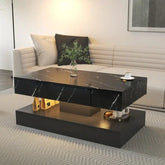 Modern black marble coffee table with storage in a minimalist living room setting