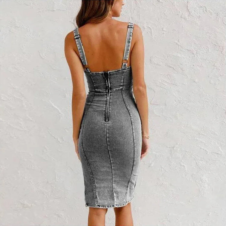 Back view of woman wearing fitted gray denim midi dress with thick straps