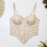 Beige satin corset top with structured boning, molded cups, and adjustable straps, laid flat.