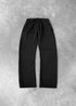 Black relaxed fit sweatpants with elastic waistband, soft cotton material, flat lay