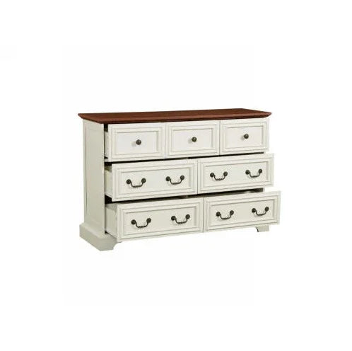 White wooden dresser with a brown top, seven drawers, classic metal handles, modern vintage style