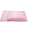 Soft pink quilted bath mats with bubble texture, layered in three sizes for bathroom comfort
