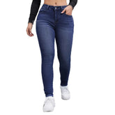 Woman wearing high-waisted blue skinny jeans, stretch denim, slim fit, casual style