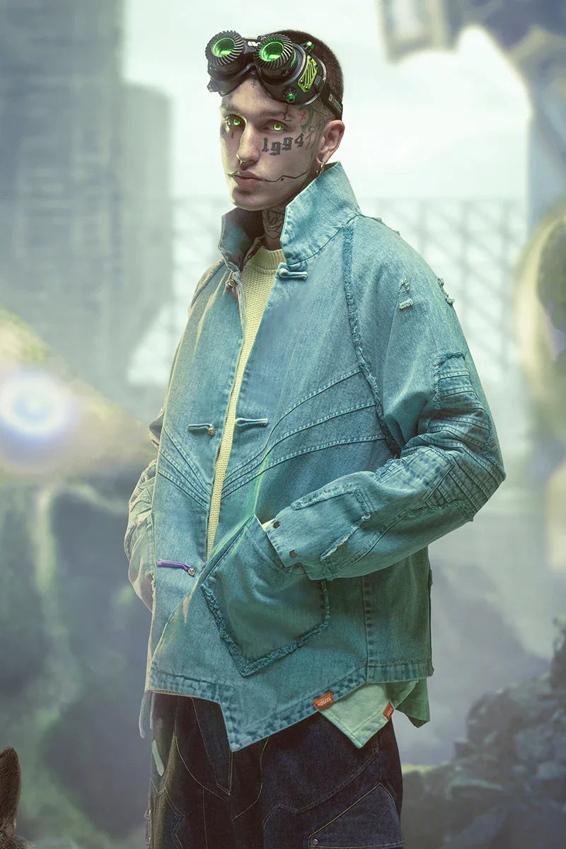 Model in distressed light blue denim jacket with relaxed fit, layered over sweater, futuristic streetwear style