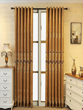 Brown velvet curtains with gold floral patterns in a classic living room setting
