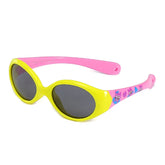Oval sunglasses with yellow front, pink arms, cartoon graphics, and dark lenses
