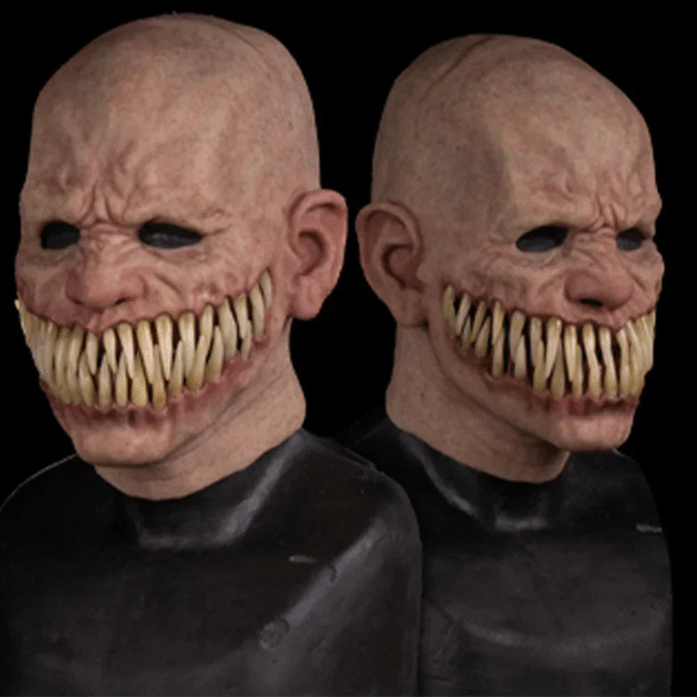 Realistic horror mask with bald design, sharp teeth, and black eye details, latex material