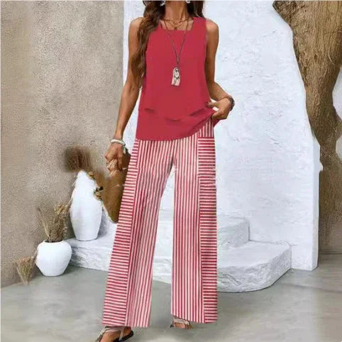 Woman wearing sleeveless red top and wide-leg red striped pants, relaxed streetwear style