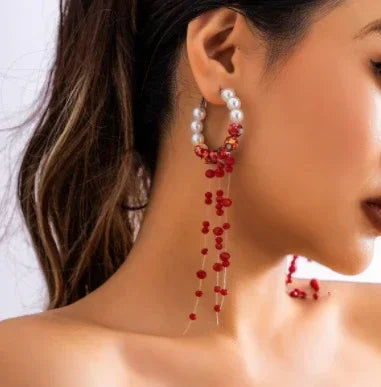 Elegant drop earrings with pearl hoop and red bead accents, chic statement jewelry
