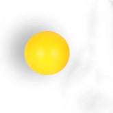 solid yellow rubber ball with matte finish on white background