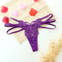 Purple lace butterfly thong with strappy sides and floral lace detailing, laid flat