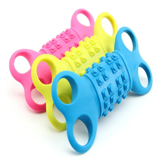 Three colorful silicone finger exercisers with textured grips in blue, yellow, and pink.