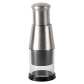 Stainless steel manual food chopper with clear plastic base on white background