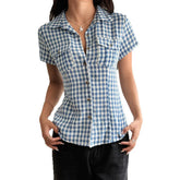 Blue and white gingham short sleeve button-up blouse, fitted cotton, casual streetwear style.