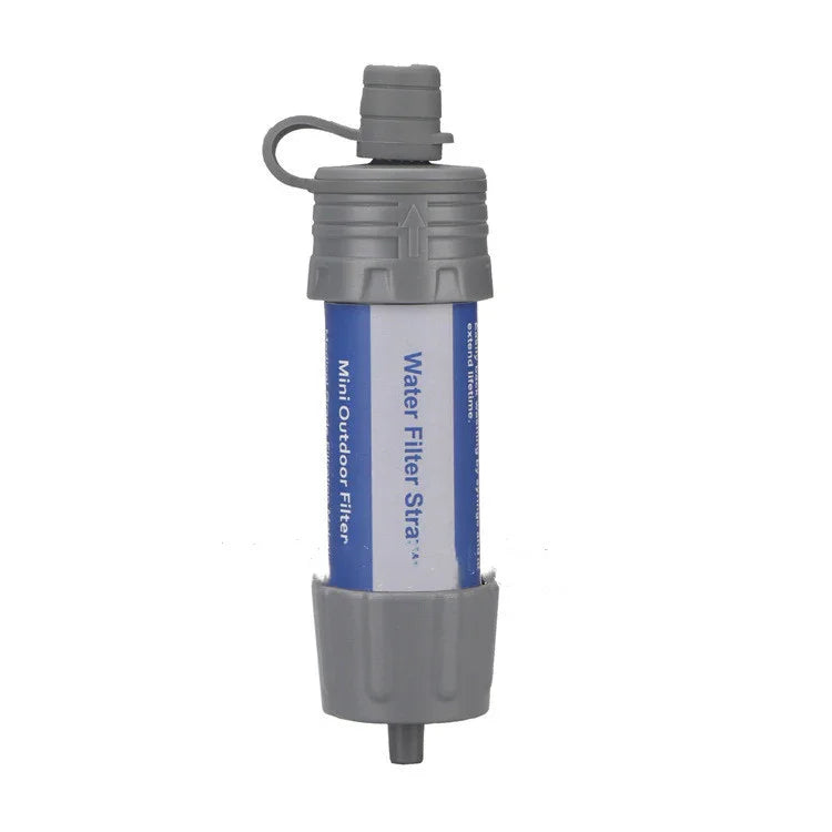 Portable blue and gray water filter straw with protective caps, compact outdoor gear