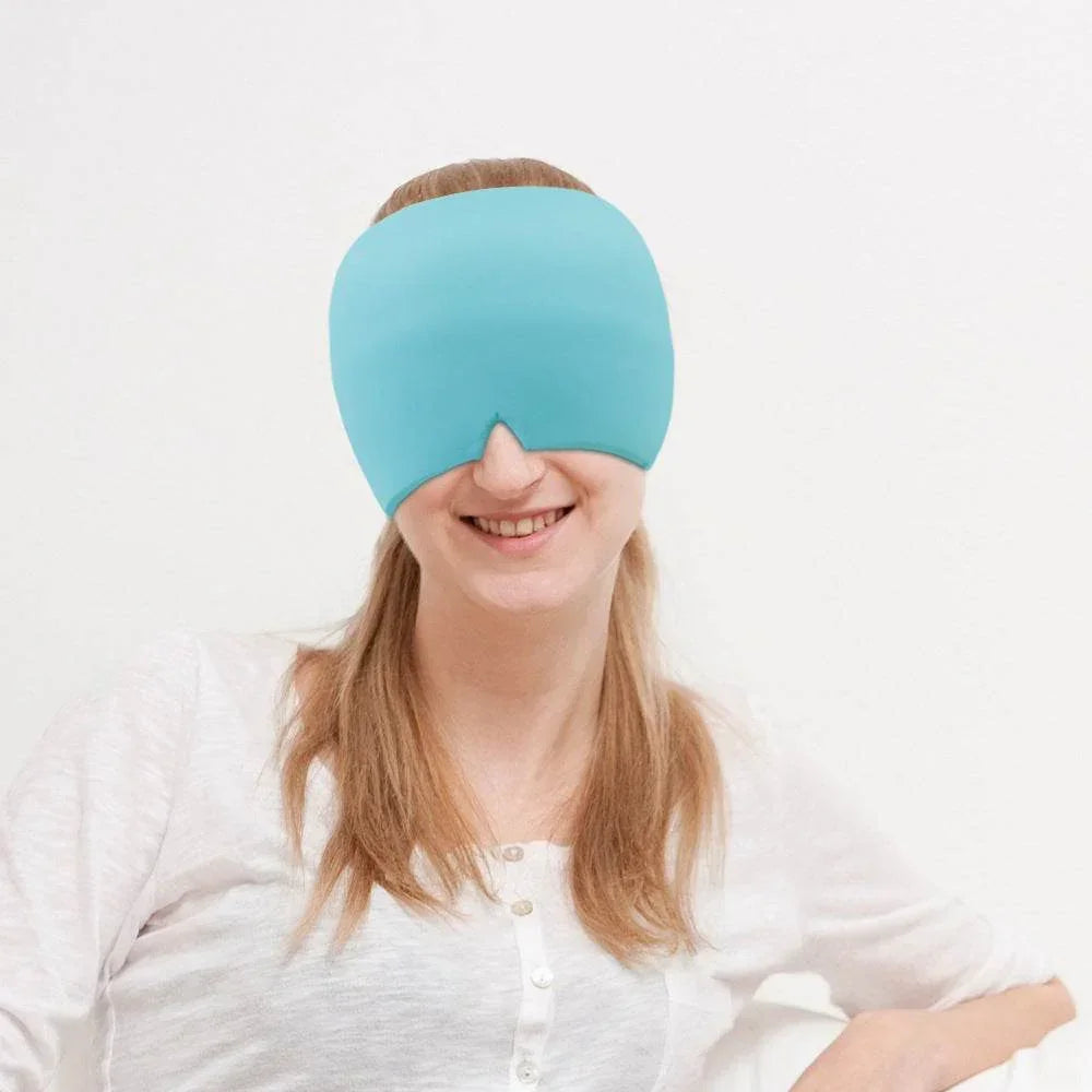 Woman wearing a light blue oversized eye mask, soft fabric, relaxed fit, casual top