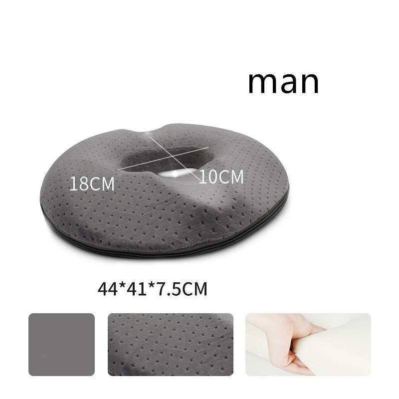 Gray memory foam donut seat cushion, round shape, soft perforated fabric, ergonomic design, dimensions 44x41x7.5 cm.